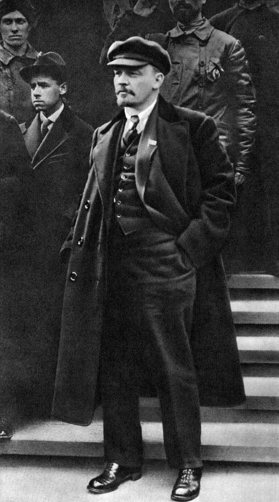 Lenin looking very stylish in a three piece suit and cap.