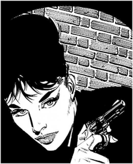 A headshot in black and white of Modesty Blaise holding a revolver by her shoulder. A brick wall is partially illuminated behind her by a spotlight.