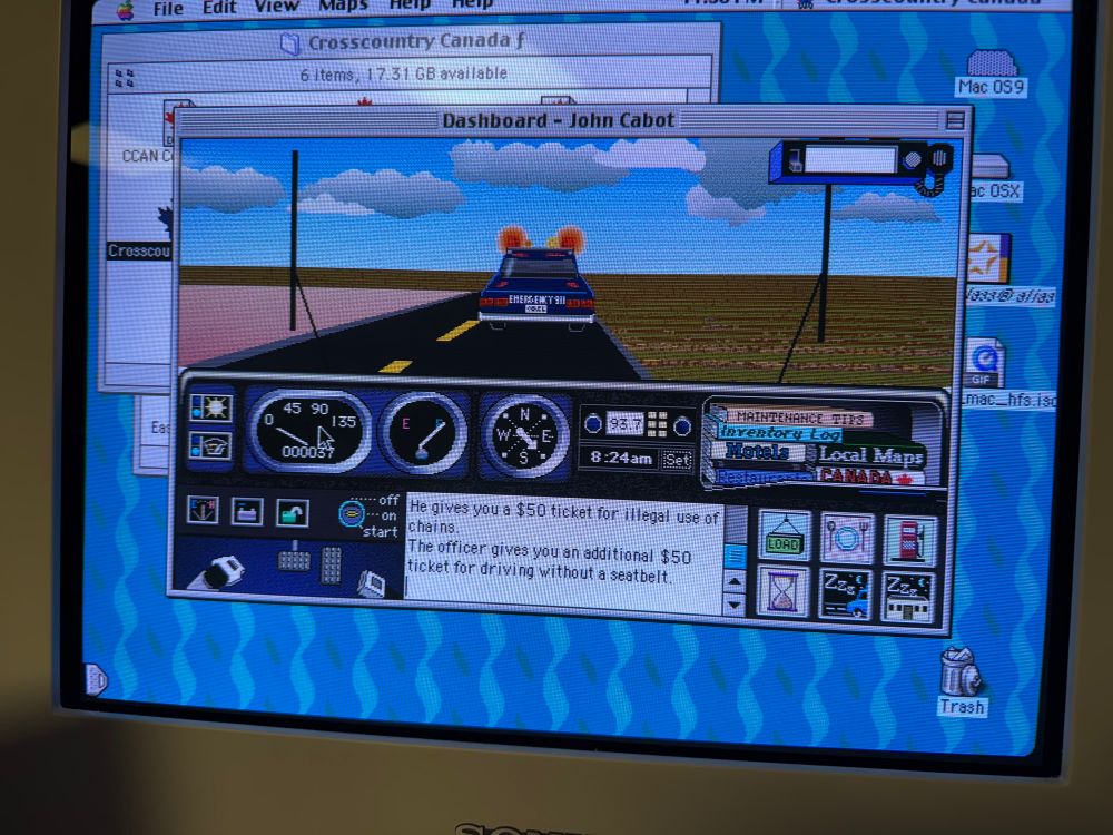 Cross country Canada on Mac OS 9. A police officer is fining me for driving with chains and not wearing a seatbelt