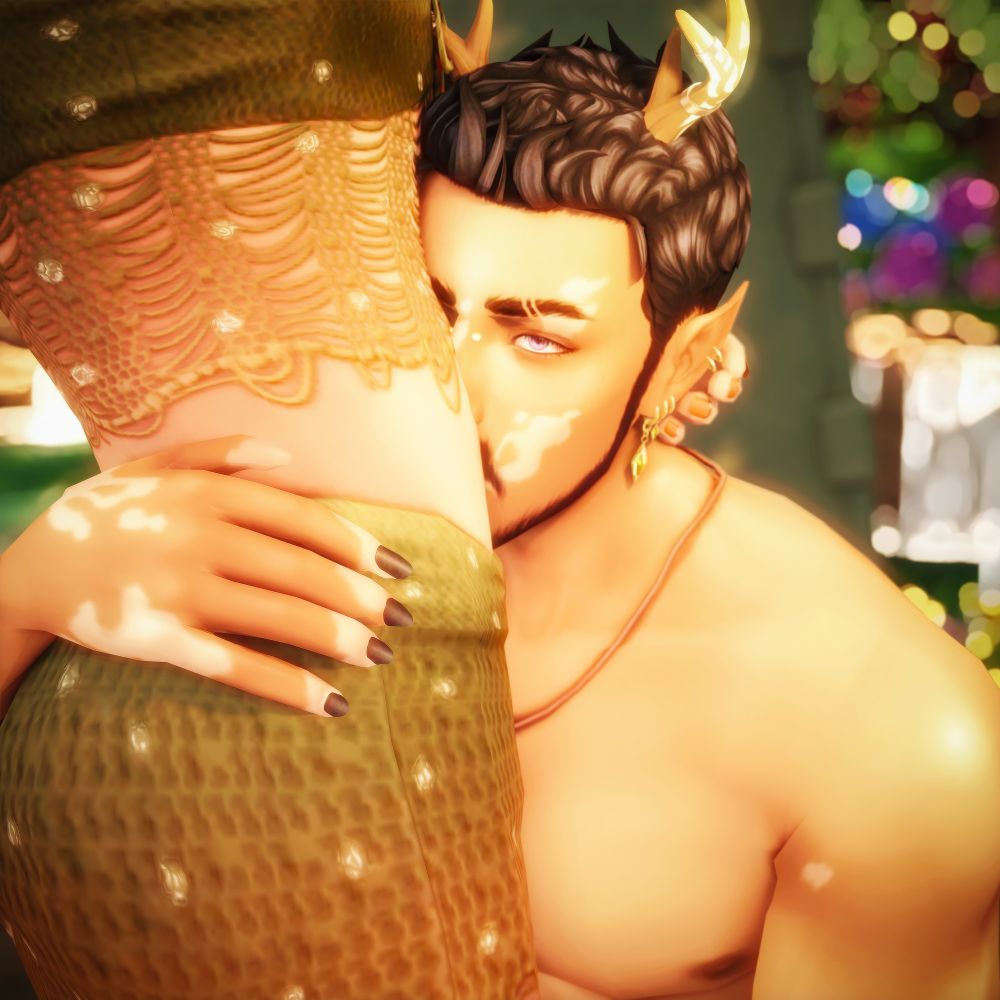 A screenshot from The Sims 4. My two sims, Rori (left) and Alix (right). Alix is down on one knee kissing Rori's exposed stomach and has his hand places on Rori's hip, while Rori's fingers are caressing Alix's ear. 