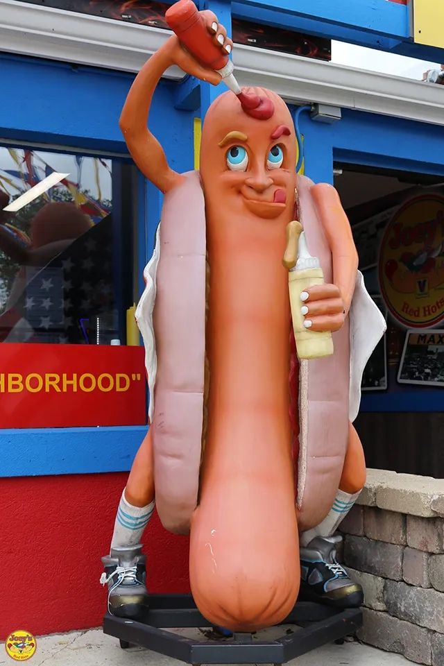 Hot dog mascot with correct face and arm placement