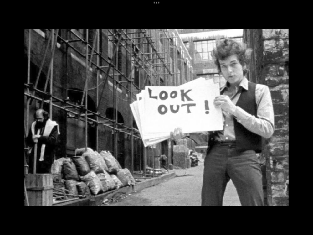 Bob Dylan with warning sign