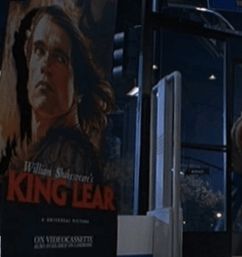 A movie poster inside a video store in San Diego for a version of King Lear starring Arnold Schwarzenegger from the film Jurassic Park Lost World