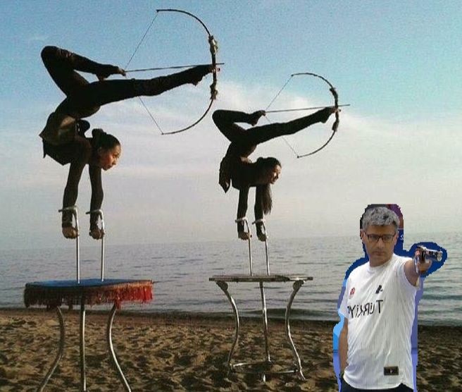 Yusuf Dikec, the nonchalant Turkish shooter from the Olympics aiming a pistol with one hand in his pocket as two women on what appear to be crutches on tables do handstands and bend their torsos such that they fire bows with their legs, it's really something