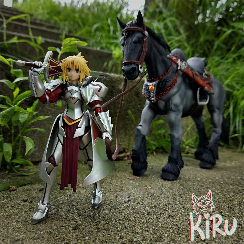 An outdoor picture of actionfigures, Mordred from Fate and  a large blueroan drafthorse following her. they are surrounded by grass and walking on concrete stairs that are overgrown. 