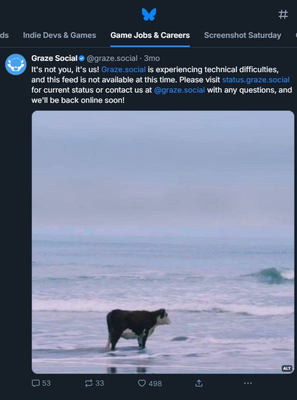 Screenshot from the custom Game Jobs and career feed showing a "technical difficulties" post. The post has an image attached showing a single cow standing about a foot deep in the water and looking out into the ocean.