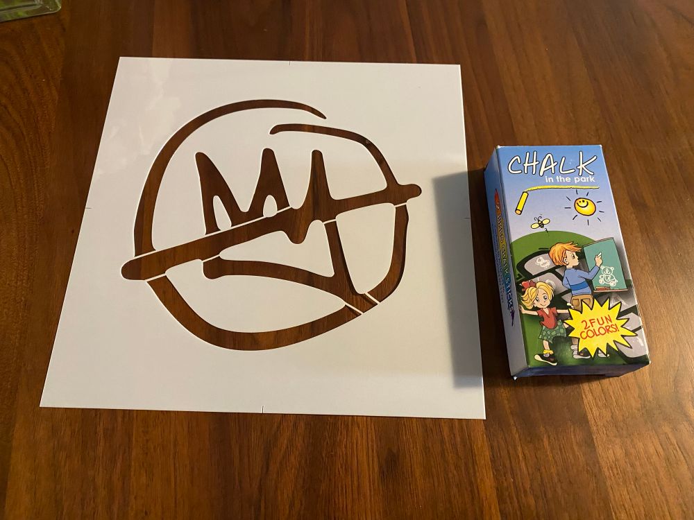 No Kings stencil and sidewalk chalk