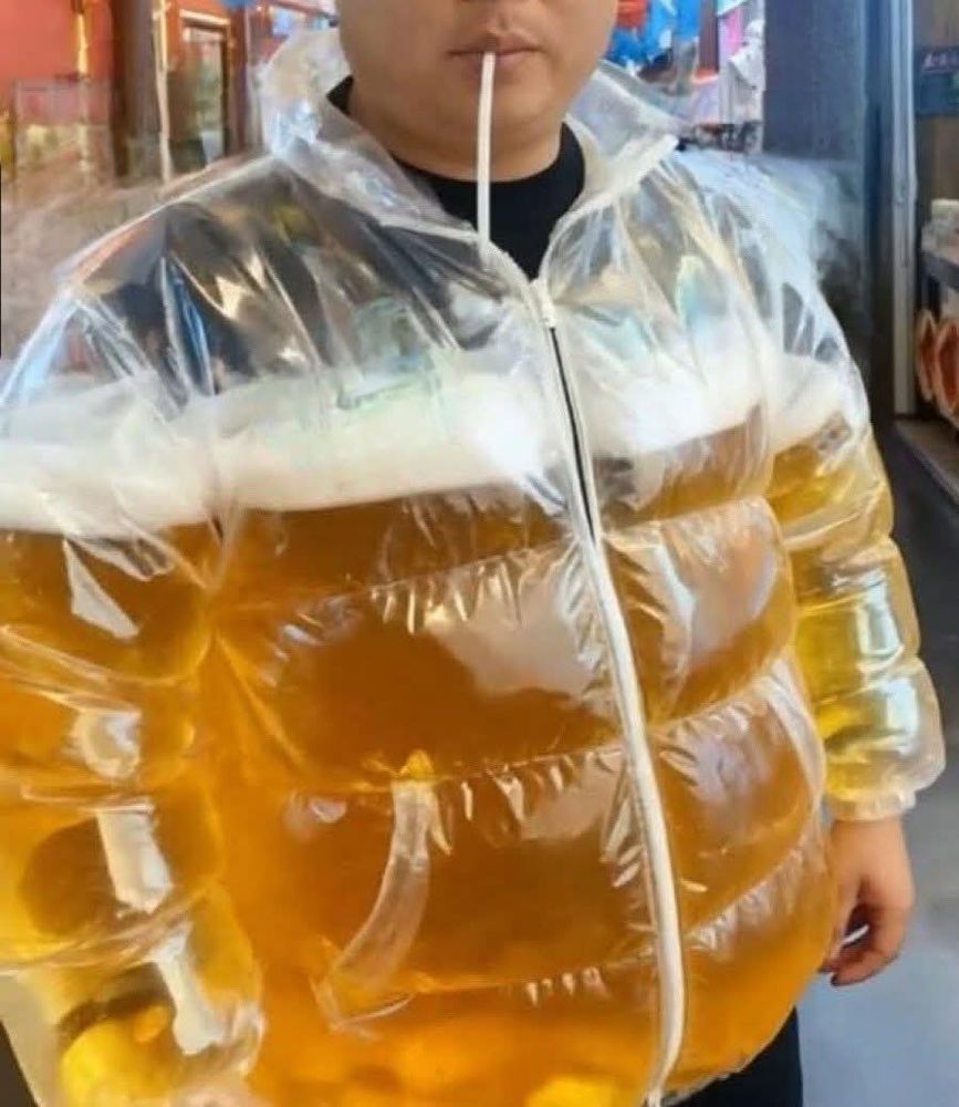 A man wearing a jacket which is transparent and 3/4 full of beer.