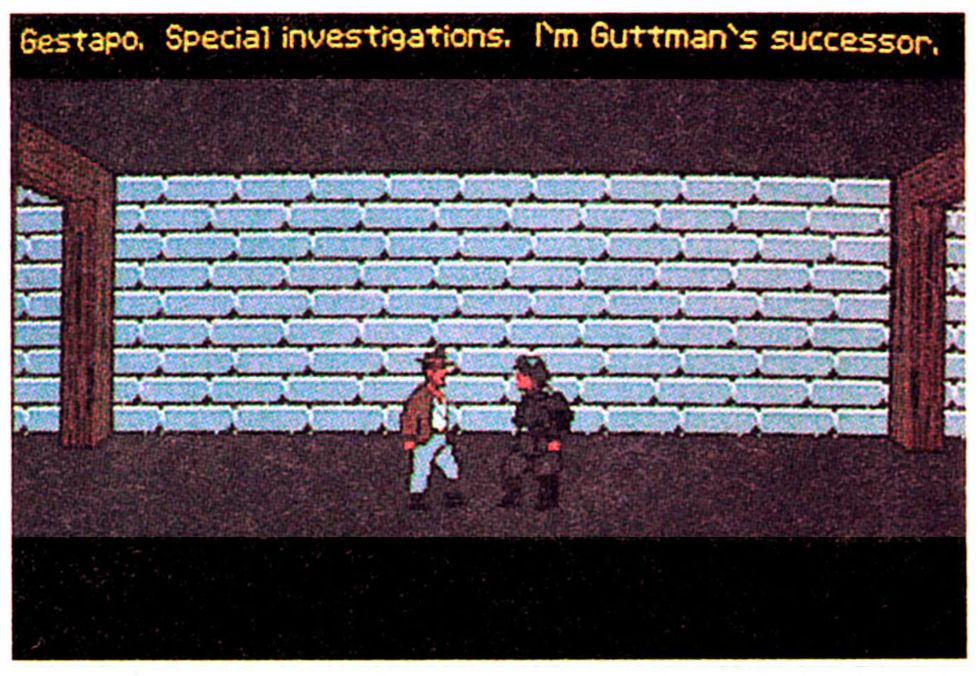 An early screenshot of Indiana Jones and the Last Crusade adventure game, from Game Player's PC Strategy Guide vol. 2 #4, September/October 1989. The screenshot in question shows an early version of the background used when Indy confronts Nazis face-to-face in the corridors of Castle Brunwald. The background is wider than in the final game, extending all the way to the edges of the screen, with the wooden beams holding up the ceiling moved outward accordingly. The floor and ceiling are still unfinished, and are depicted as solid expanses of dark gray. Indy is dressed in his regular outfit, but his stance is different than in the final game, as is that of the Nazi soldier he's facing. Indy is saying "Gestapo. Special investigations. I'm Guttman's successor." The apostrophe character used here is different as well, oriented like a descending single quotation mark.