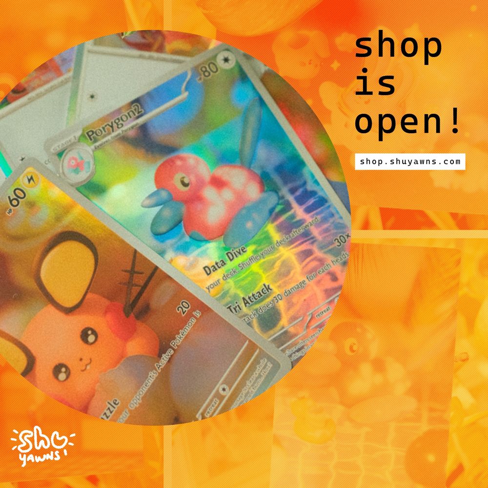 graphic announcing that my merch shop is open! features a snapshot of fanmade pokemon cards, and prints in the background.