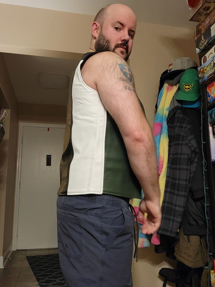 Got a new leather vest! It's green black and white