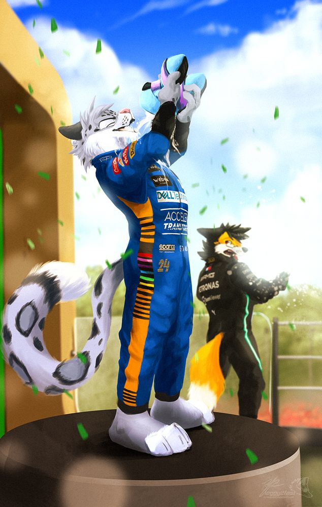 Picture of Kieran doing a shoey at the podium in Monza. Raf is visible in the bg, showing an expression of surprise.