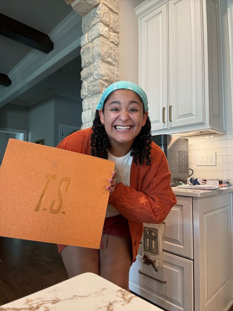 Liv cheesin in her cardigan