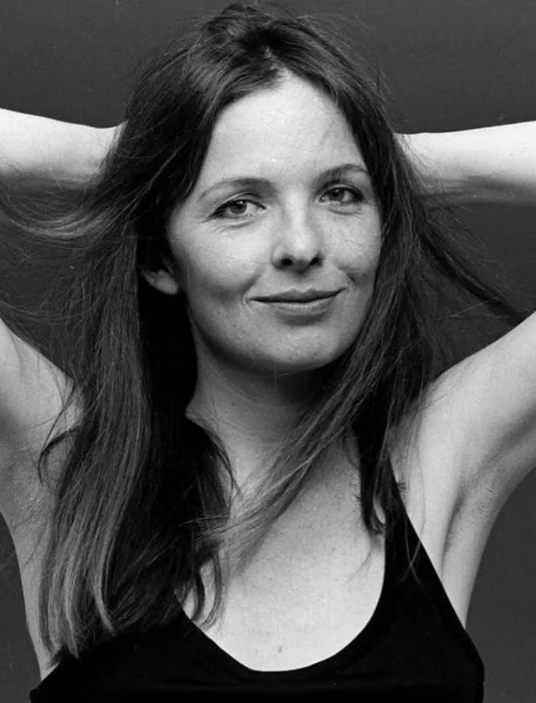 B&W picture of Diane Keaton
with arms behind her head.