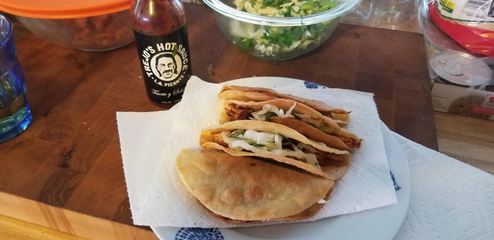 Delicious fried chicken tacos with cilantro-slaw and Trejo's hot sauce.