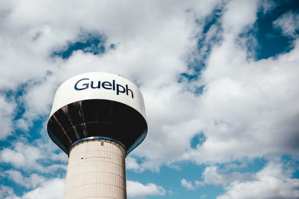 Guelph water tower with blue sky and clouds in the background.