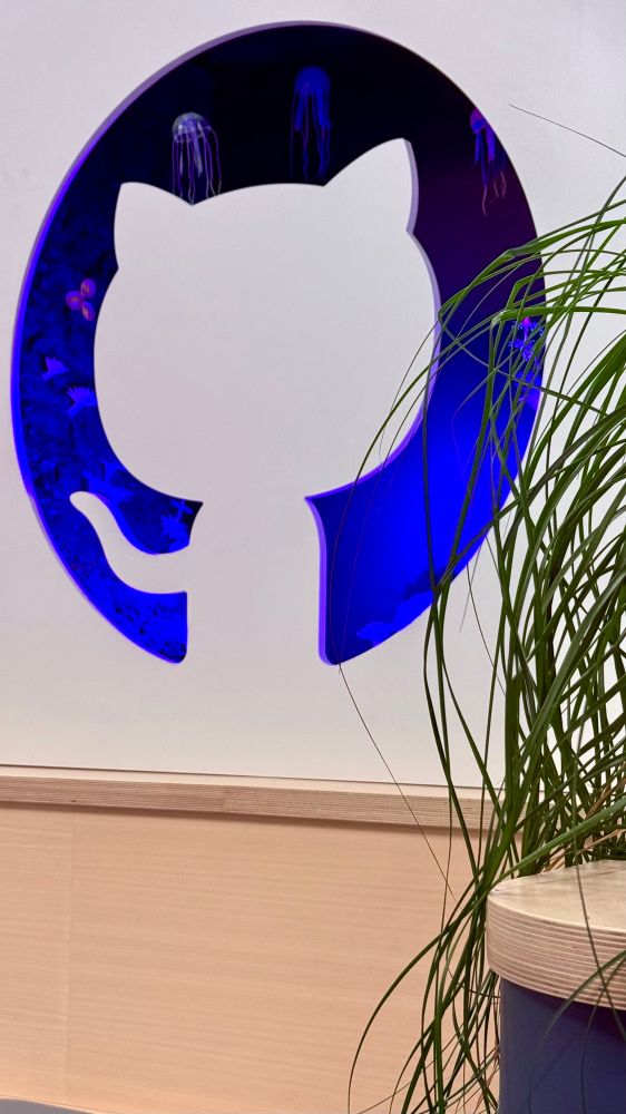 Github cat cutout art installation with deep sea creatures like jellyfish in the background