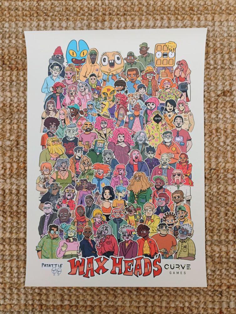 Wax Heads poster on a rug, the poster has lots of illustrated characters on it from the game 