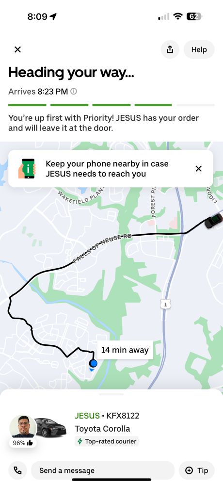 Uber Eats progress page, with a delivery driver named “JESUS” and a notification that says “Keep your phone nearby in case JESUS needs to reach you.”