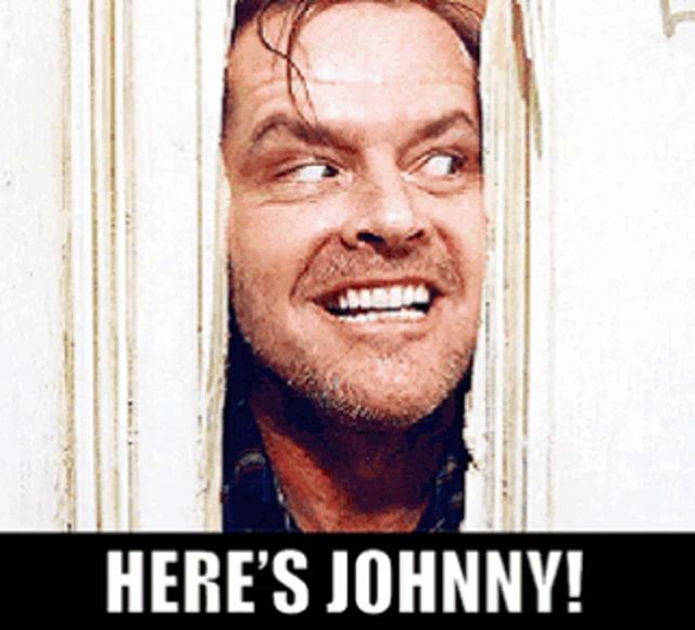 a man looking through a door with the words here 's johnny written below him