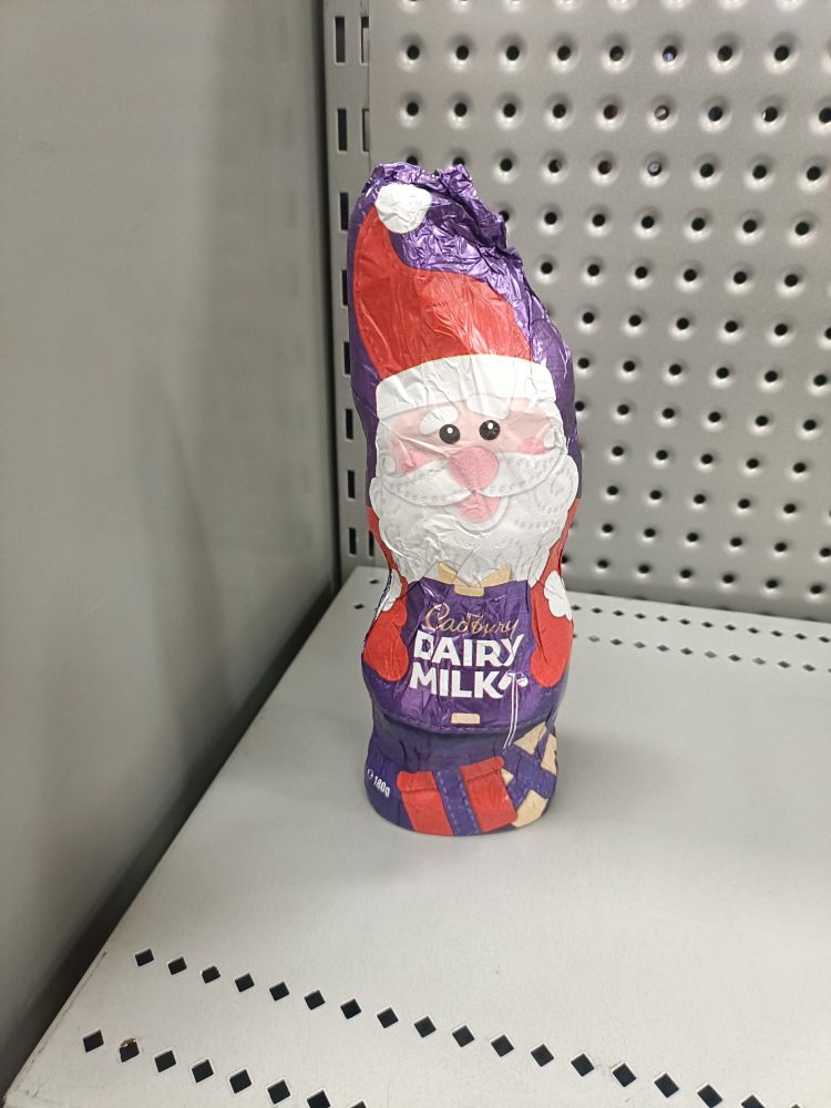A goddamn Easter Bunny wrapped up as a Santa with a suspiciously upright hat