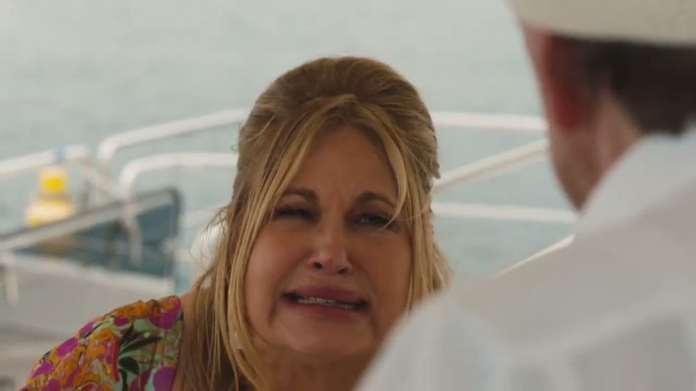 A screenshot of Tanya from The White Lotus season 2, about to say: 'These gays are trying to murder me.'