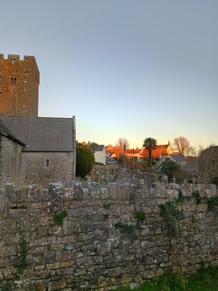 The church and nearby buildings in the last of the sun today. 