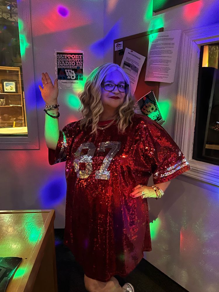 Lunalazyltng dressed as Travis Kelces Girl Taylor at a Chiefs game in sequined 87 dress and blond wig with party lights 