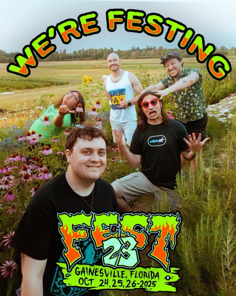 Sad Snack arrayed in a field of flowers and it says “we’re festing!”