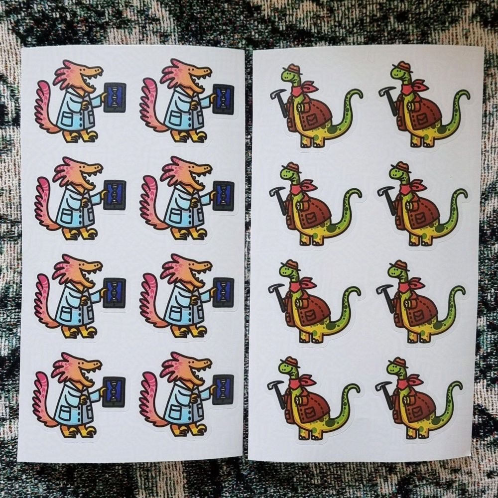 two sticker sheets with 8 stickers each, on the left is a pink feathery velociraptor geneticist wearing a blue labcoat and ipad with a DNA strand, on the right a yellow green brontosaurus paleonthologist with a tiny hat, neck scarf, leather jacket, holding a hammer.