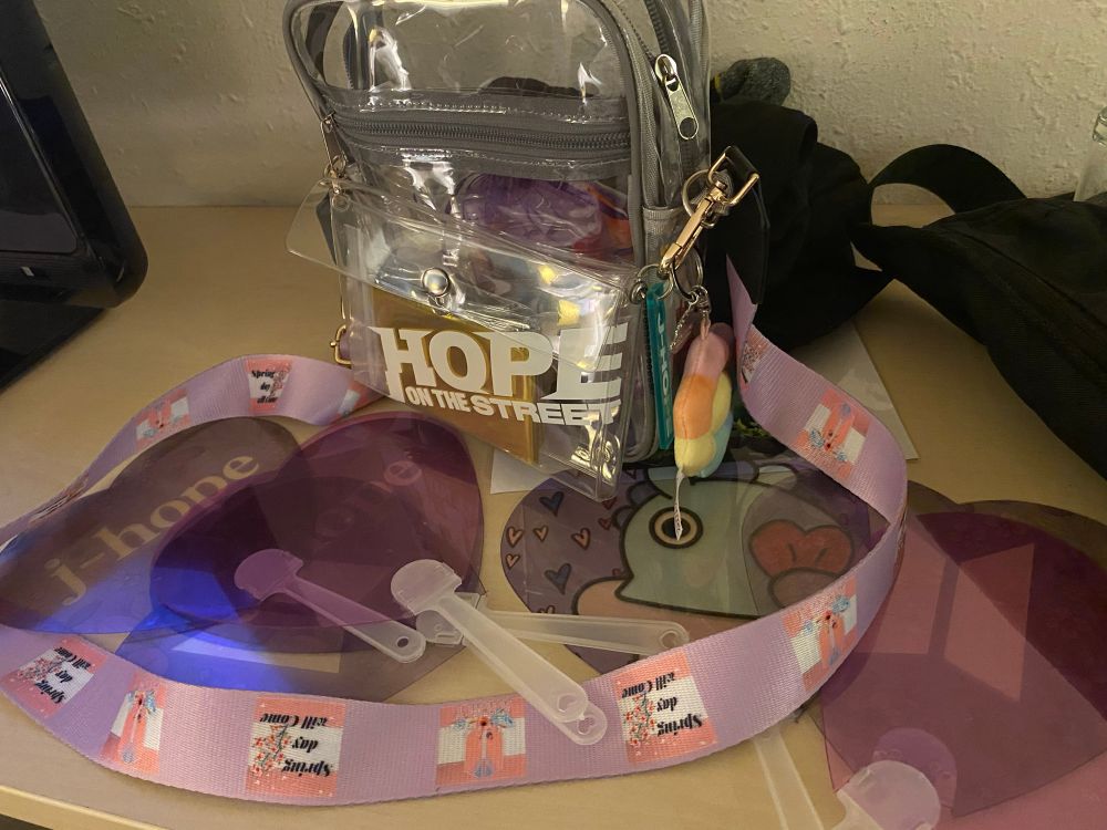 Picture of a Transparent Bag with Hope on the street written on it, a spring day lanyard and freebies around 