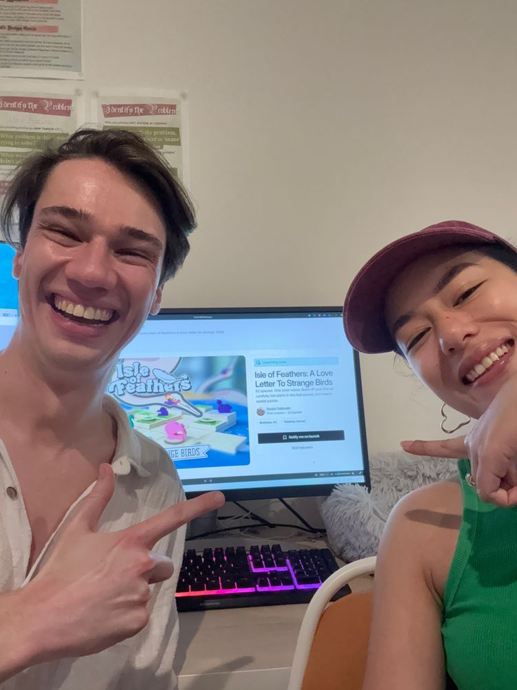 Daniel and Juno in front of their computer monitor, with the Kickstarter page open. You can see the follower count is at 800.
