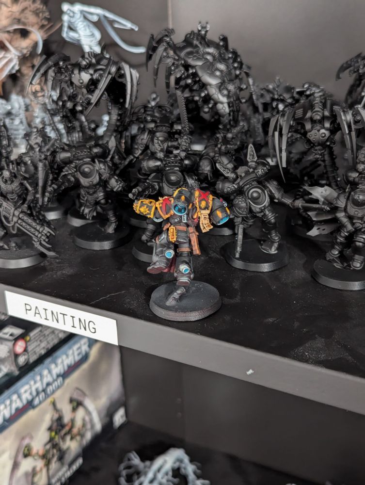 Rear view of a Blood Angels death company jump intercessor, painted with non metallic metal gold