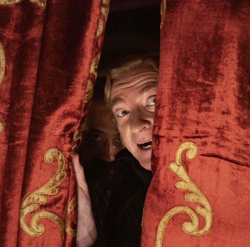 stede and ed peeking out of red velvet curtains to watch the spooky talent show. i had to brighten it up a bit because you couldn't see cutie ed in the background. he's so cutie it's important
