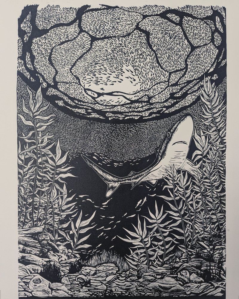 'Ocean Blue'
Lino cut print
Artwork of an underwater scene with a school of fish at the top, a shark in the middle and plants and rocks at the bottom.