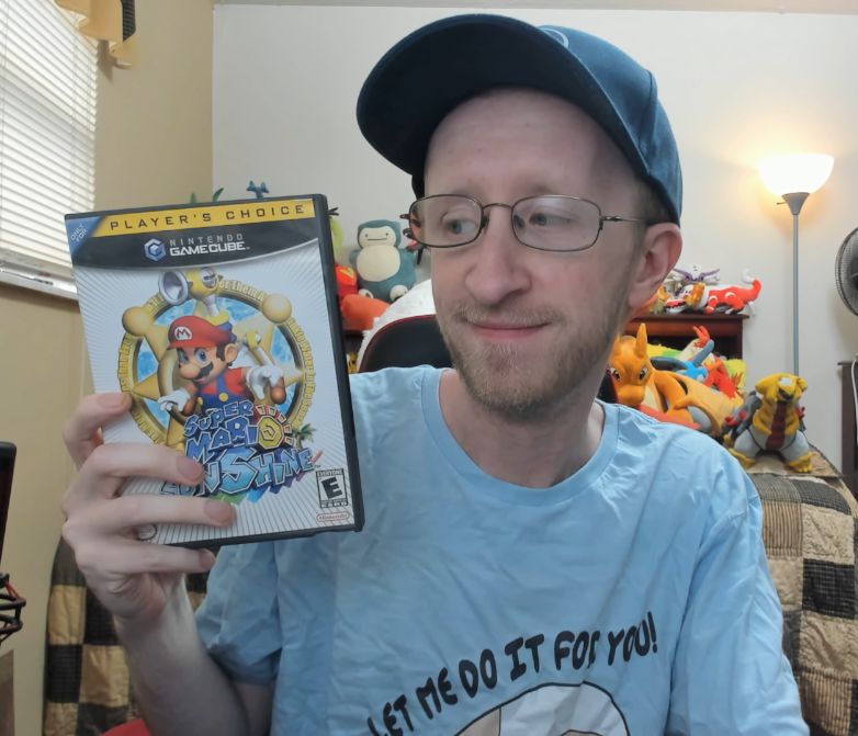 JB holding up  his copy of Super Mario Sunshine