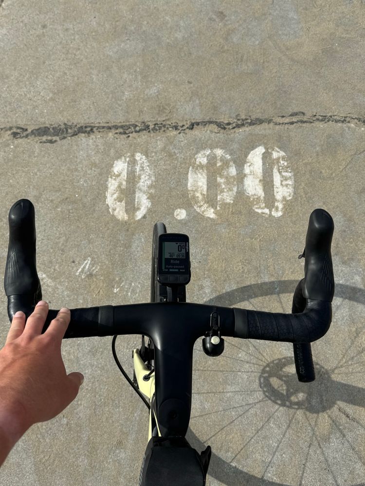 Bike handlebars at the 0.00 mile marker for the Marvin Braude bike path in Los Angeles (technically at Torrance Beach).