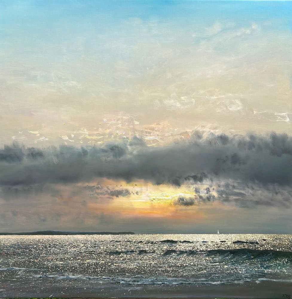 a sea scape with sun low in the sky