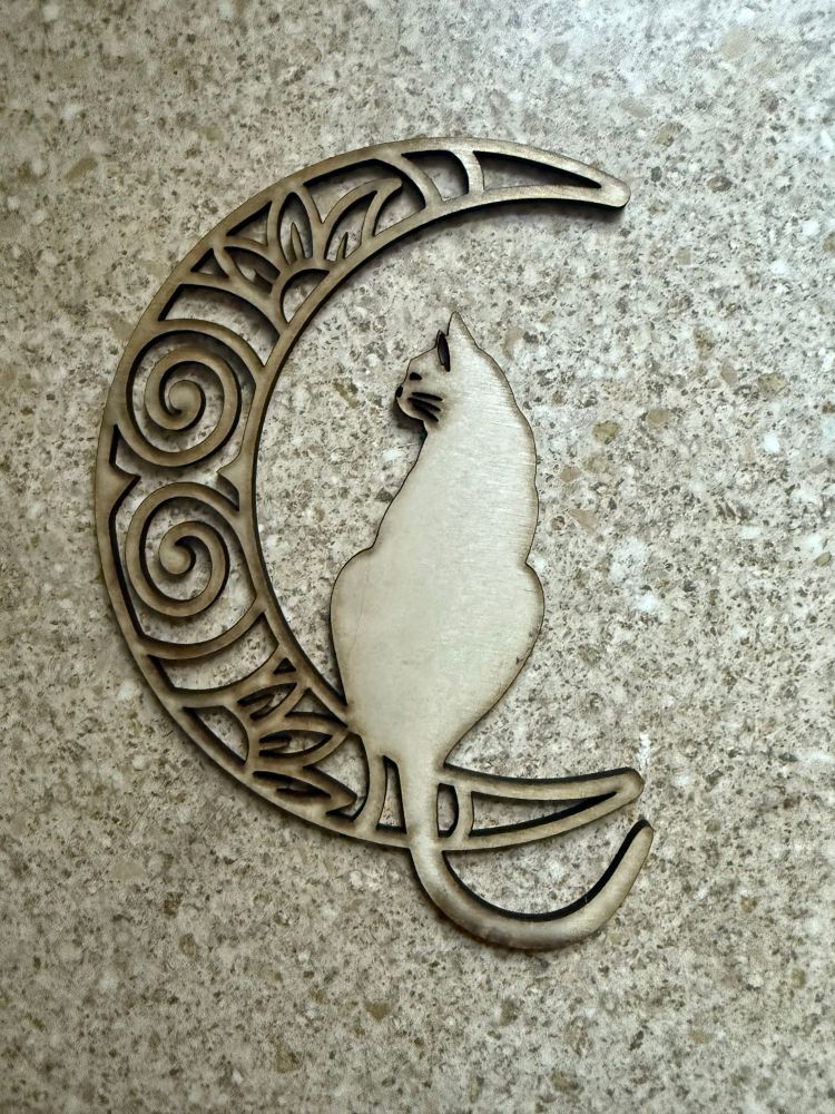 Cat sat on a crescent moon design laser cut into wood