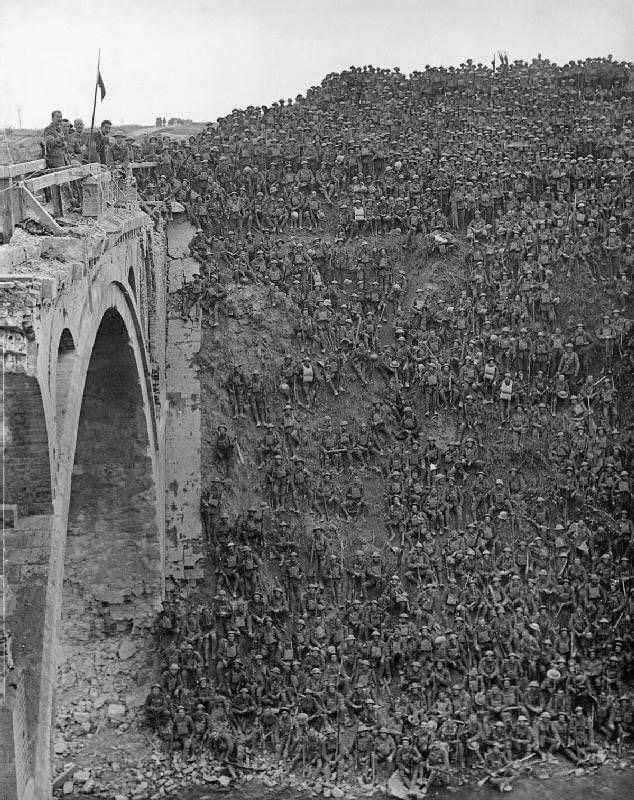 This image shows British soldiers of the 137th (Staffordshire) Brigade resting on and around the Riqueval Bridge over the St. Quentin Canal in northern France on September 29, 1918.