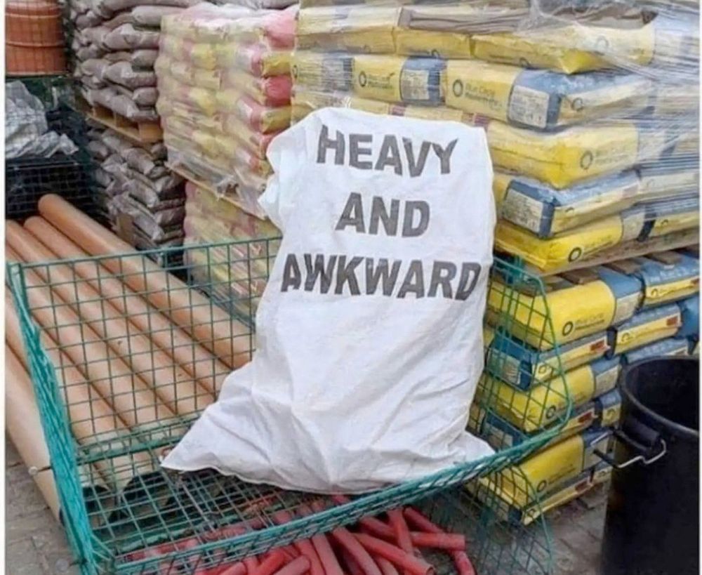 a bag with 'heavy and awkward' written on it