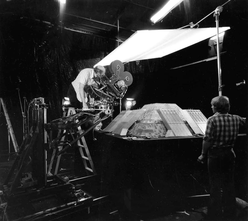 photo
a behind the scenes shot of filming one of the large building. a model is used with overhead lighting