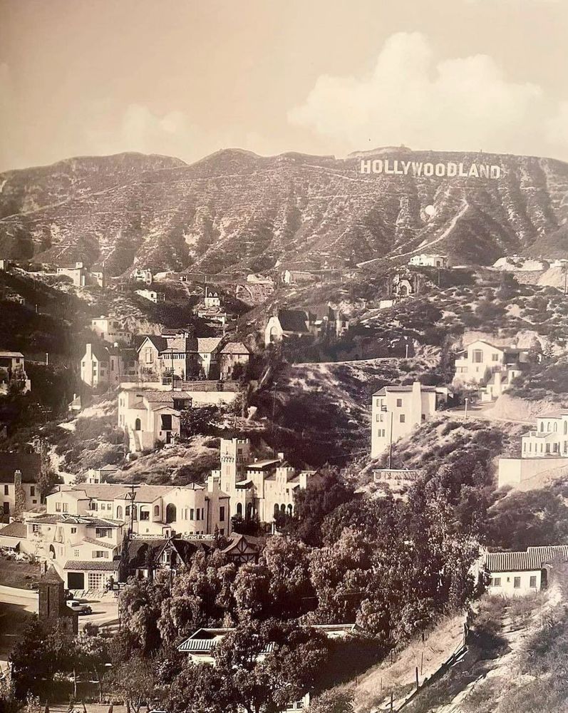 view of houses in canyons and hills , Hollywoodland sign on a distant hill