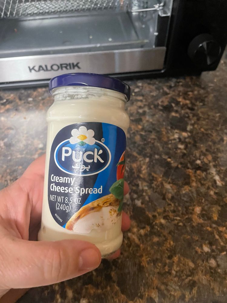 Puck (بوك) cheese spread in the iconic Kraft blue lid. It’s like cream cheese but thinner and stronger. It’s glorious.