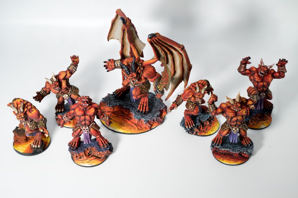 PAXU24 Arcadian Brush - Advanced Squad Winner: Shouting loincloth-clad demons, atop lava bases. Their winged leader wields a large blade.