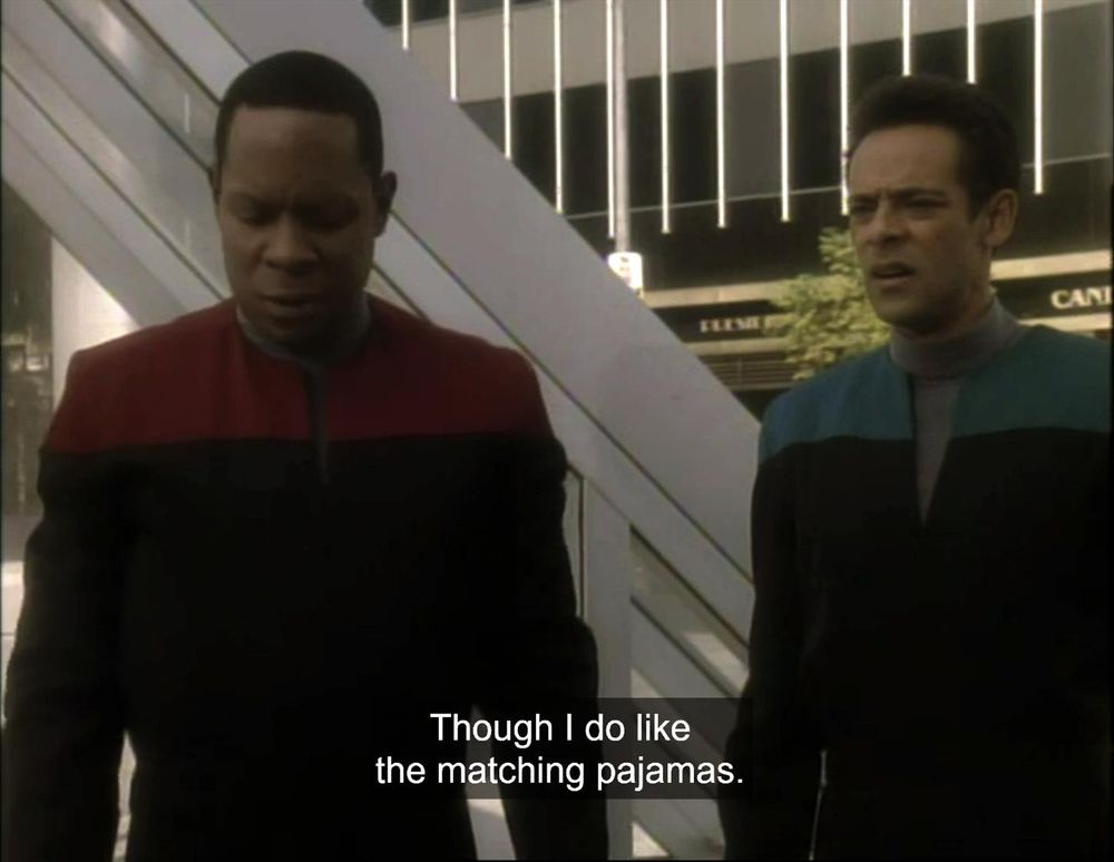 DS9; "Past Tense"; Sisko and Bashir in 21st century San Fransisco, wearing Starfleet command red and medical blue, with (offscreen) caption: Though I do like the matching pajamas.