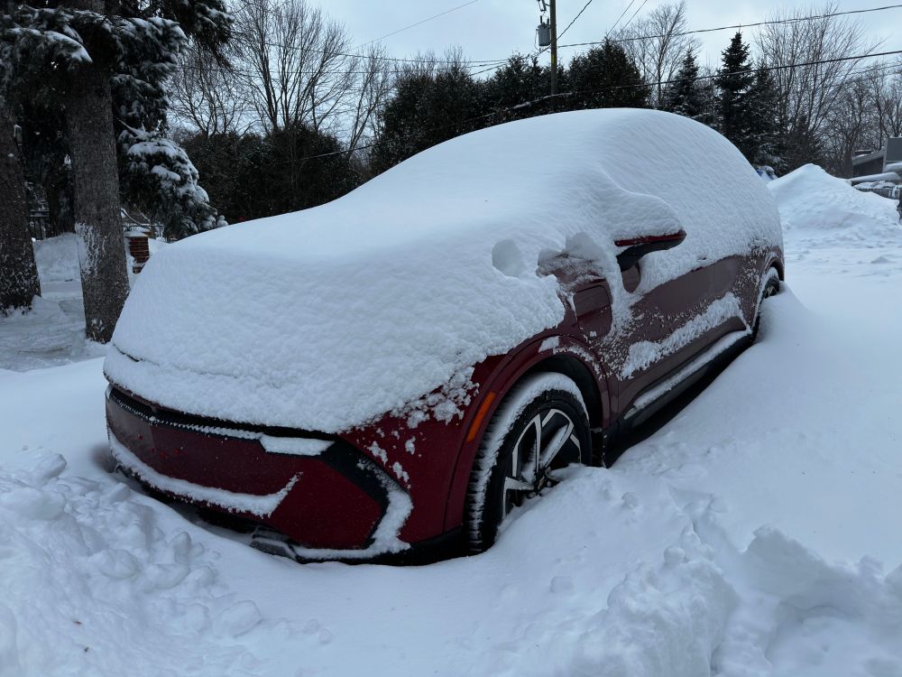 Equinox EV buried in the driveway from our first big snow storm this season