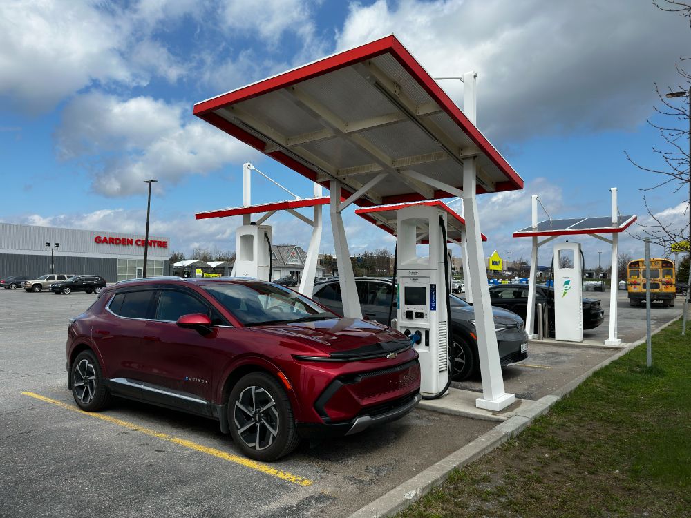 Evie the EV at a Electrify Canada charging station
