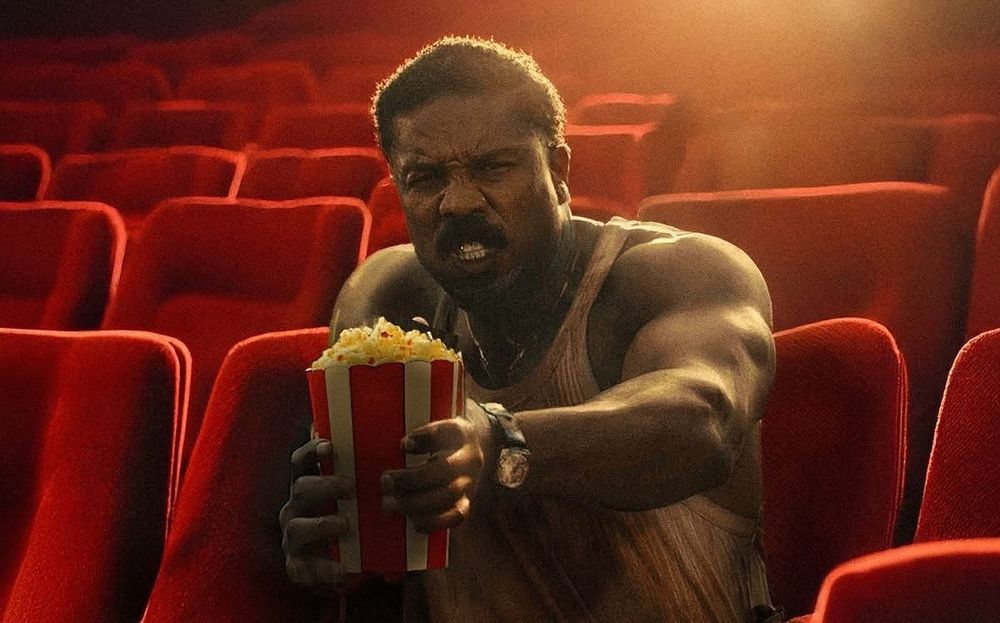 Smoke from Sinners in a theater shooting with popcorn.