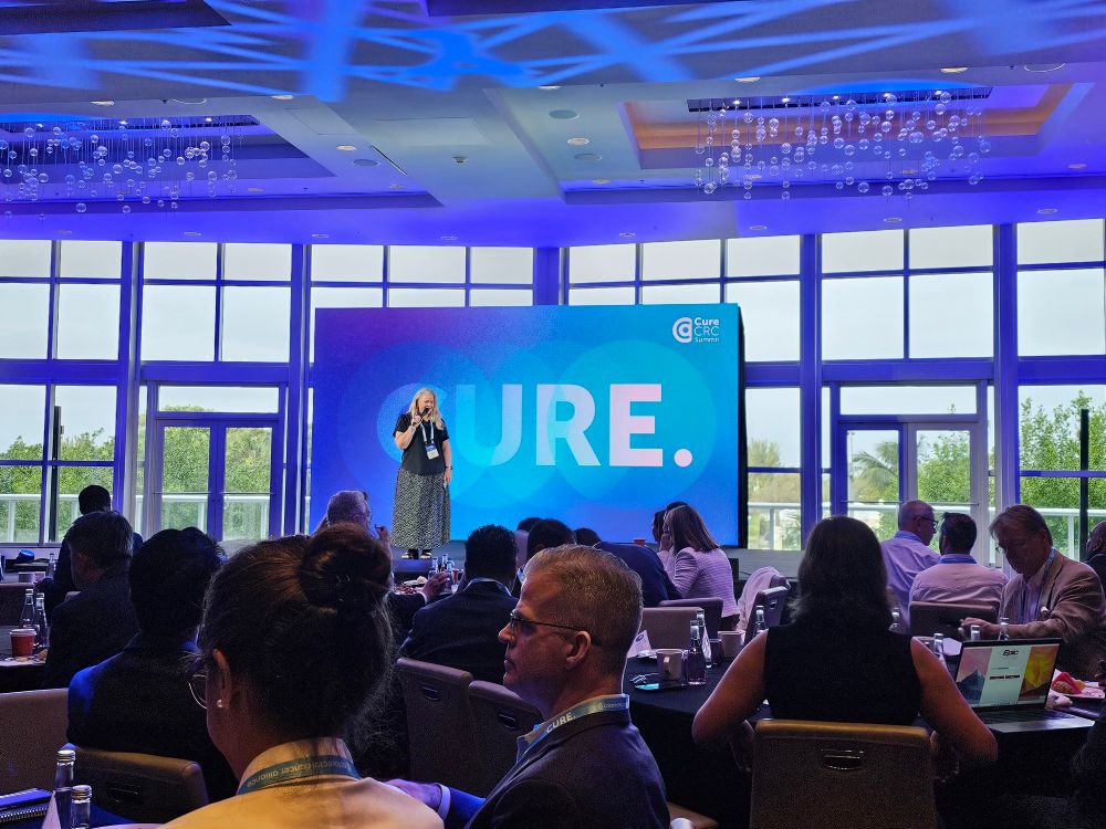 Image shows the stage at the CureCRC summit where the CRC Alliance brings together scientists from industry, academia, and philanthropic groups to accelerate the race for a Cure for colorectal cancer.